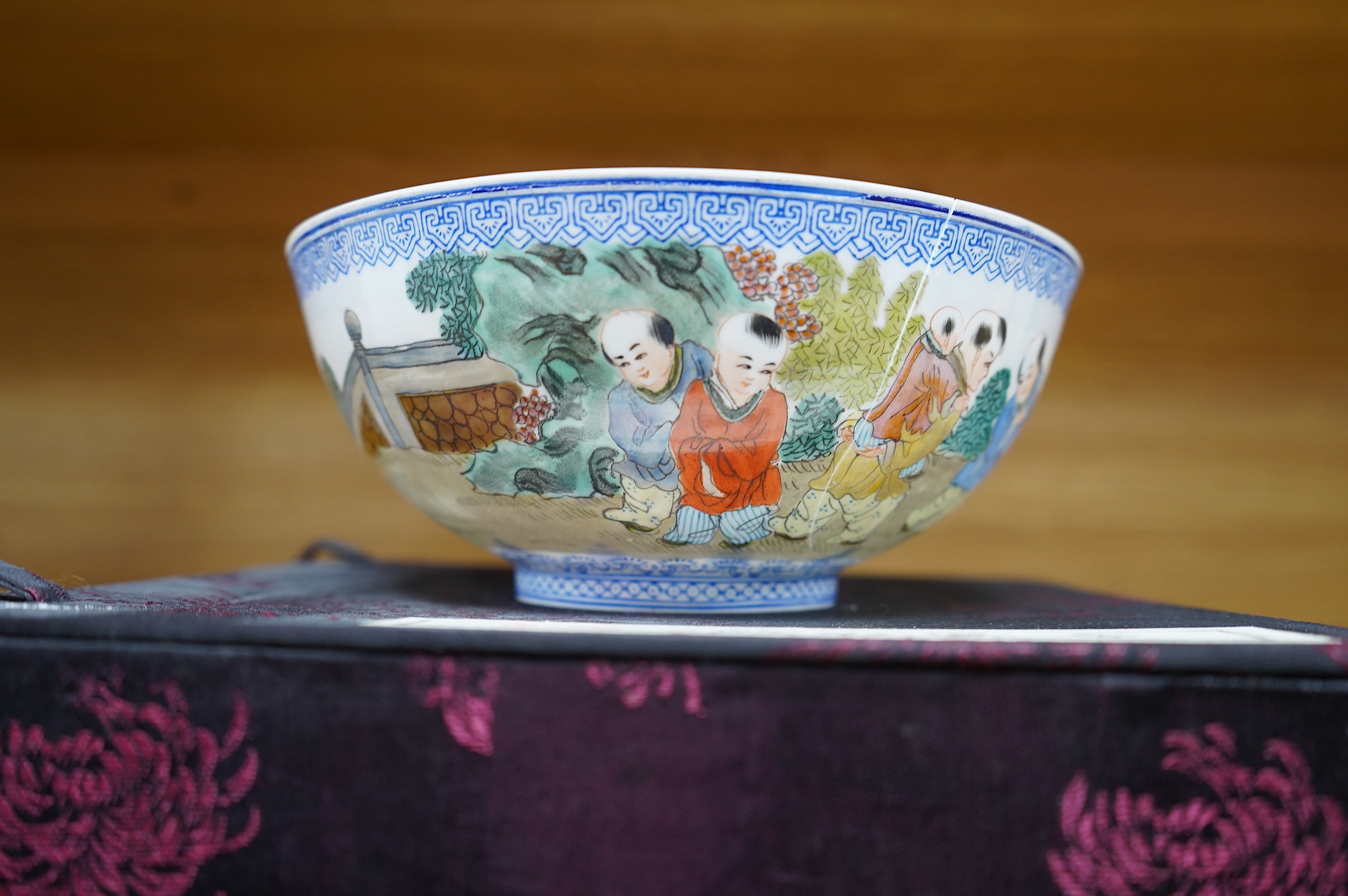 A Chinese eggshell porcelain bowl, 18cm diameter, boxed. Condition - poor, broken and partially repaired